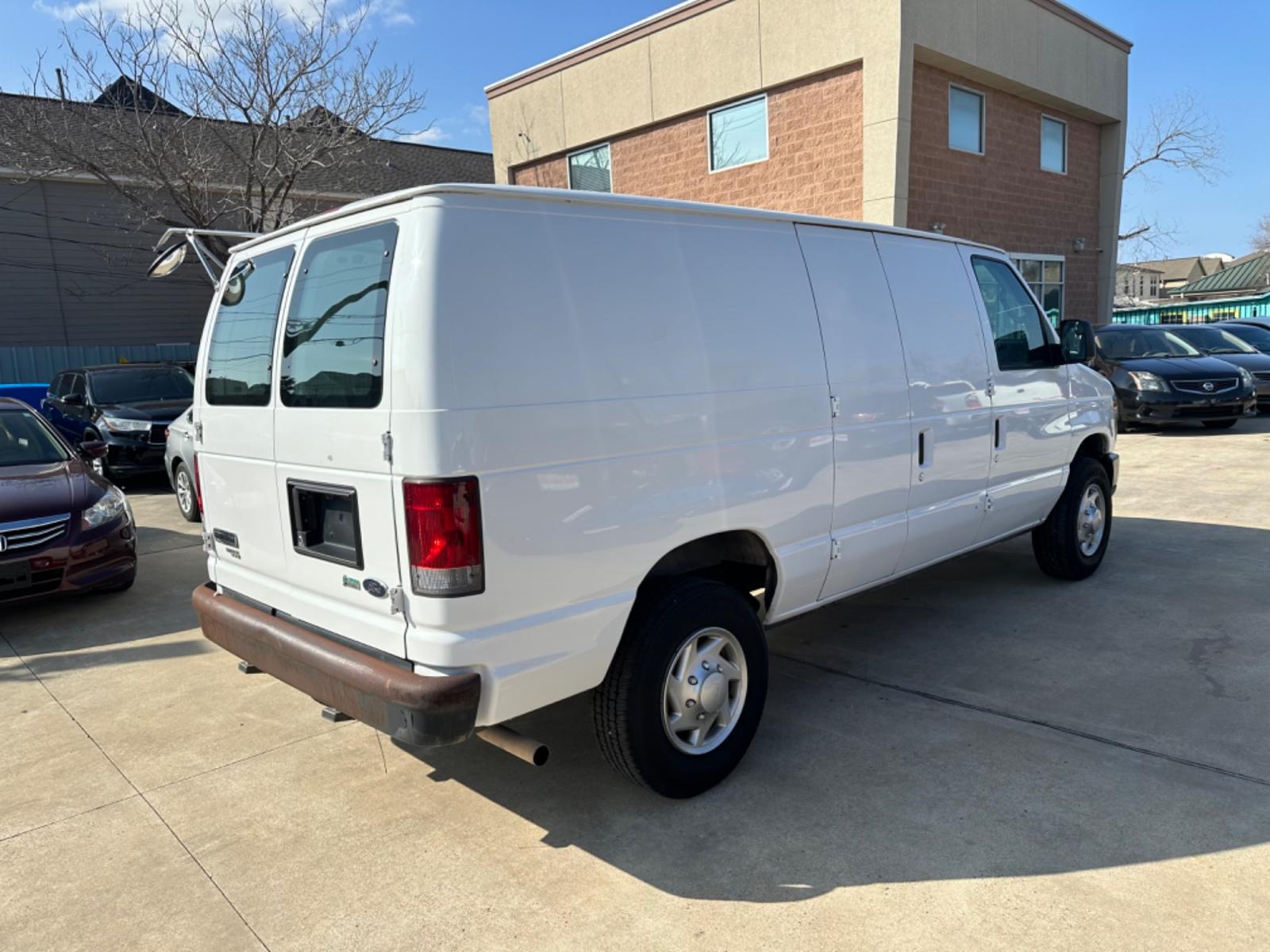 2011 White /Gray Ford E-Series Van (1FTNE2EWXBD) with an 4.6L engine, Automatic transmission, located at 1501 West 15th St., Houston, 77008, (713) 869-2925, 29.797941, -95.411789 - Photo #2